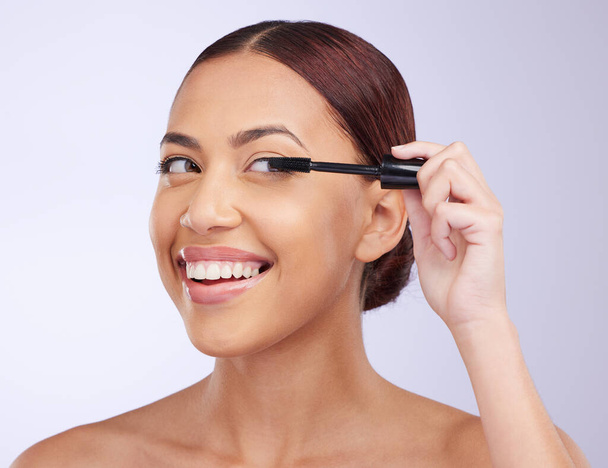 Face, mascara makeup or happy woman in studio isolated on white background in facial treatment. Skincare beauty, grooming brush or girl model smiling with tools or luxury self care eyelash cosmetics. - Foto, Bild