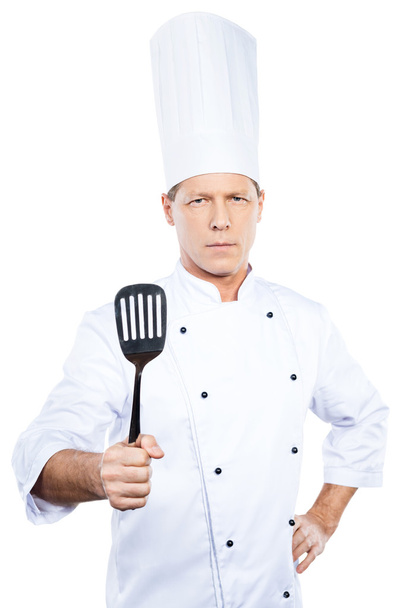 Mature chef  holding spatula - Fotó, kép