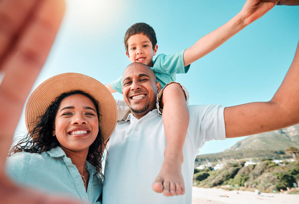 Happy family, smile and selfie at beach for summer with child, mother and father for fun. Man, woman and boy kid portrait for happiness and freedom on a holiday with love, care and support outdoor. - Photo, Image