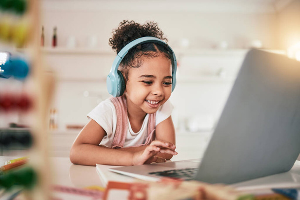 Laptop, home education and happy child elearning, kindergarten homework or remote school work. Knowledge website, learning software and young kid streaming youth development lesson on headphones. - Photo, Image