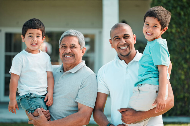 Dad, grandpa and children outdoor for portrait in backyard of house with a smile, love and care. Man, senior and boy kids family together for security and quality time with happiness and support. - 写真・画像