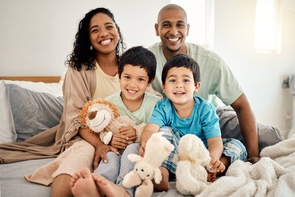 Happy family, bed and portrait of parents and children bonding in a bedroom in a house and playing together. Care, mother and father excited with kids in the morning as love, happiness and care. - Fotoğraf, Görsel