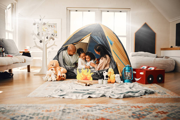 Love, home camping and happy family bonding, relax and enjoy time together having fun in living room. Happiness, tent and youth children playing with mother, father or parents in house adventure. - Photo, Image