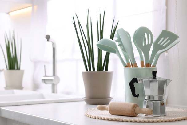 Set of different utensils on countertop in kitchen, space for text - Foto, Imagem