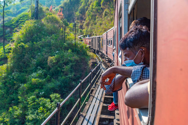 Great Western, Sri Lanka, February 1, 2022: Train winding on a hillside track among tea plantations at Sri Lanka. - Zdjęcie, obraz
