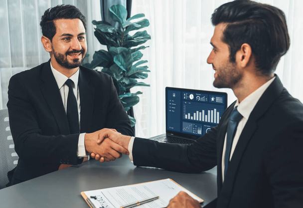 Successful job interview at business office with handshake. Positive discussion of qualifications and application for position. Job hiring concept between candidate and interviewer. Fervent - Photo, Image