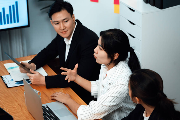 Business team of financial data analysis meeting with business intelligence, report paper and dashboard on laptop for marketing strategy. Business people working together to promote harmony in office. - Foto, Imagem