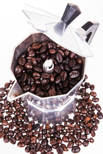 Kahvipavut ja kahvipannu
 - Valokuva, kuva