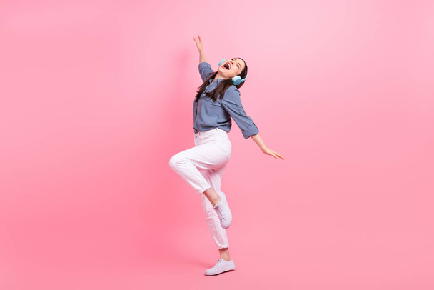 Full body photo of meloman girl dancing weekend enjoy listen loud music have fun wireless headphones formal wear isolated on pink color background. - Foto, afbeelding