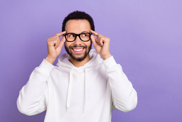 Portrait of young intellectual businessman wear comfort hoodie thoughtful look interested mockup eyeglasses isolated on violet background. - Foto, Bild