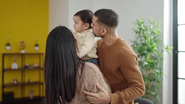 Couple and son kissing and hugging each other standing at home - Filmagem, Vídeo