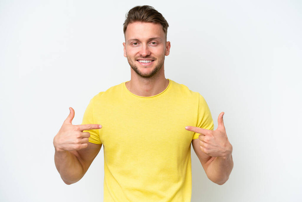 Young blonde caucasian man isolated on white background proud and self-satisfied - Фото, зображення