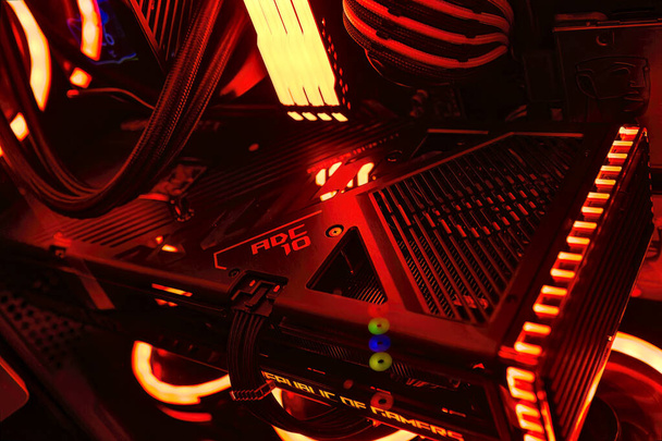 Milan, Italy 14 april 2023: Get a glimpse of the latest technology with a close-up of the NVIDIA GeForce RTX 4070 Ti GPU in an illuminated gaming PC setup. Rog Strix custom. - Фото, изображение
