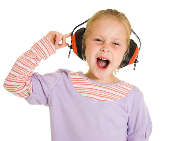 Little girl listening to music on white background - Photo, Image