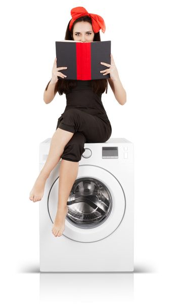 Girl Reading a Book on a Washing Machine - Foto, afbeelding