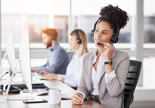 Call center, customer support and woman consultant working on online consultation in the office. Crm, business and professional African female telemarketing or sales agent with headset in workplace - Fotografie, Obrázek
