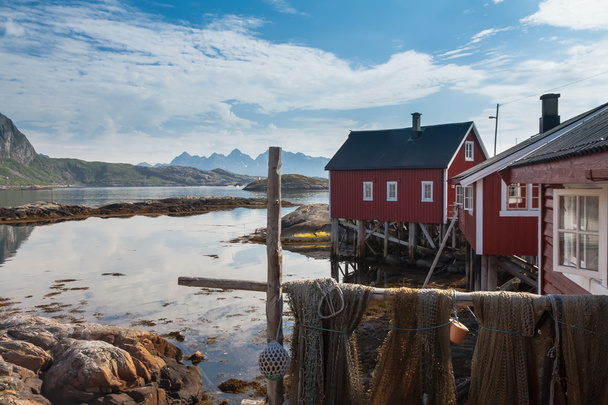 Typical red rorbu fishing hut in town of Svolvaer - 写真・画像