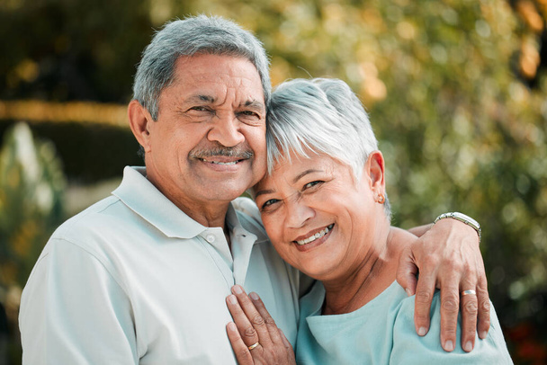 Senior couple, portrait and hug in park, garden and nature for love, care and happiness in summer. Happy man, elderly woman and retirement of marriage partner, relax and smile of quality time outdoor. - Photo, image
