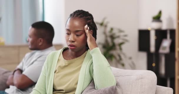 Sad, ignore and fight with black couple on sofa for divorce, breakup and conflict. Crisis, relationship problem and frustrated with man and woman in living room of home for depression, toxic or anger. - Footage, Video