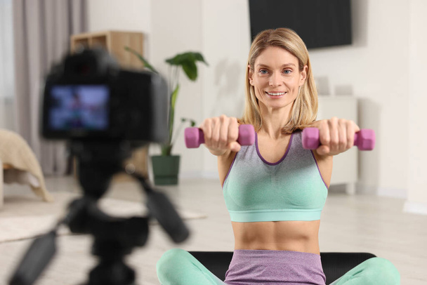 Fitness trainer recording online classes at home - Fotó, kép