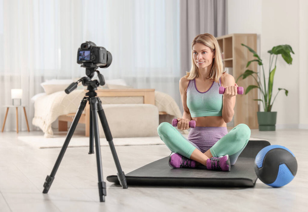 Fitness trainer recording online classes at home - Foto, immagini