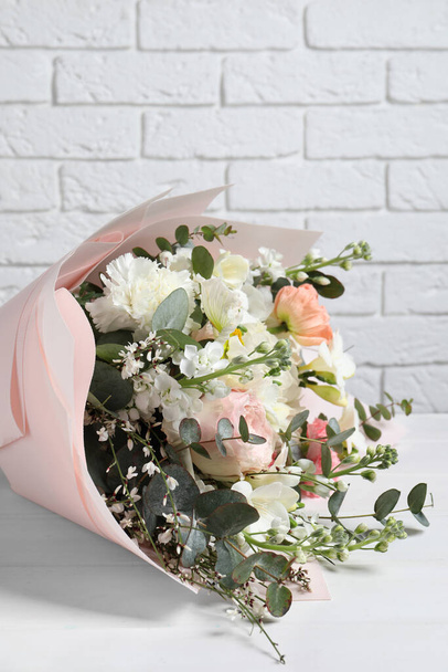 Bouquet of beautiful flowers on white wooden table, closeup - Φωτογραφία, εικόνα