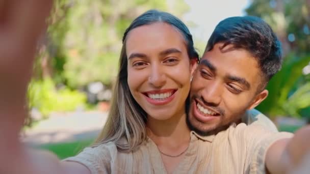 Selfie, love and happy interracial couple in park for bonding, quality time and relax on weekend date. Relationship, dating and portrait of man and woman take picture for memories, post and smile. - Footage, Video