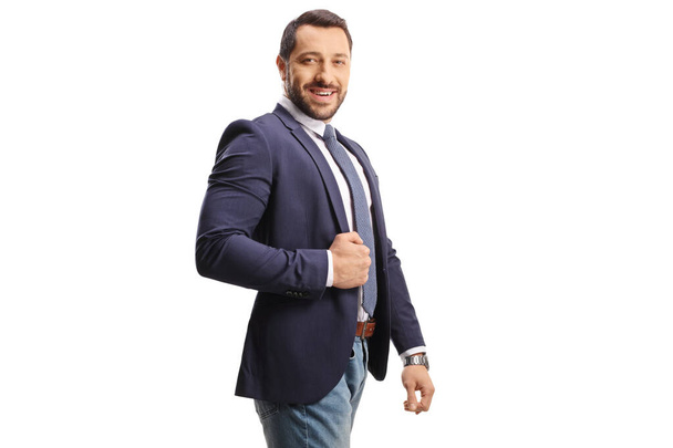Young professional man in a suit and jeans posing isolated on white background - Fotografie, Obrázek