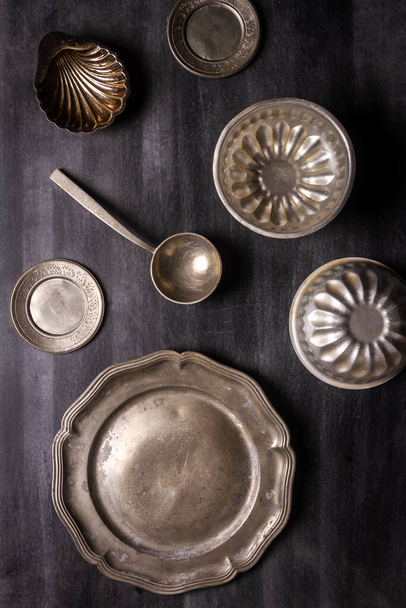 Various antique vintage dishes on black chalkboard background. Flat lay. Top view. Food concept. Dark mood food photography. - Fotoğraf, Görsel
