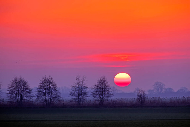 Incredible sunset in Friesland the Netherlands - Photo, Image