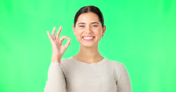 Okay hands, face and woman smile on green screen, background and studio in agreement of support. Portrait of female model, happy and ok for success, yes and winner of perfect emoji, thank you or hope. - Footage, Video