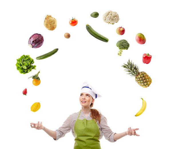 Woman cook juggling with fruits and vegetables - Фото, зображення