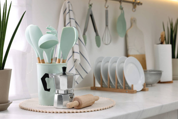 Set of different utensils and dishes on countertop in kitchen - Foto, Imagem