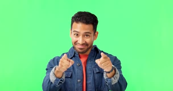 Man, come here hands and smile by green screen with excited face, happy and call by background. Young male, welcome and pointing in portrait with mockup invitation with happiness by studio backdrop. - Felvétel, videó