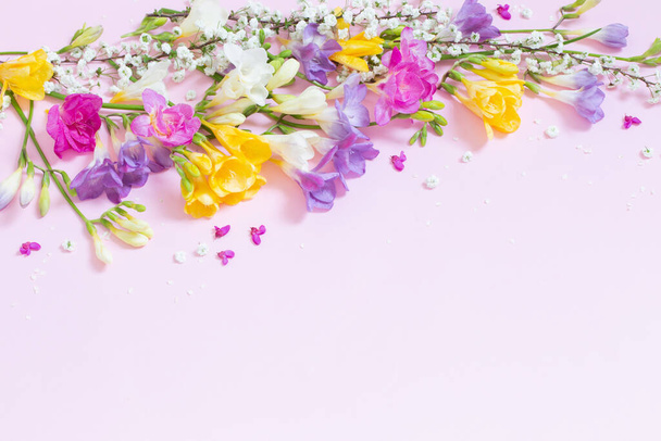 spring flowers on pastel pink background - Valokuva, kuva