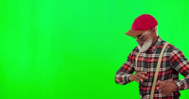 Dance, music and an elderly black man on a green screen background in studio having fun moving with rhythm. Party, fashion and funky with a happy senior man dancing on chromakey mockup for freedom. - Πλάνα, βίντεο