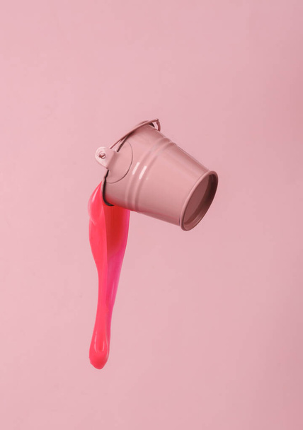 Mini Bucket with slime isolated on pink background - Foto, Imagem