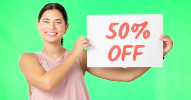 Woman, portrait and sale sign on green screen advertising percentage or discount rate on paper or banner. Smile of a happy female on a studio background for promotion deal, savings or deal and offer. - Footage, Video