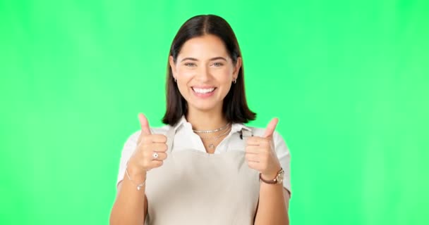 Happy woman, hands and thumbs up on green screen for good job, agreement or winning against studio background. Portrait of female cafe owner showing thumb emoji, yes sign or like for win on mockup. - Footage, Video