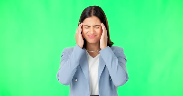 Business woman, headache and pain on green screen, studio and stress of dizzy mind, mental health and brain fog. Frustrated female worker, migraine and anxiety of burnout, problems and fatigue face. - Footage, Video