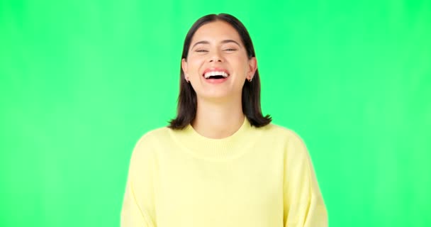 Green screen, laughing woman and face with smile, happiness and humor on color background. Portrait of happy female model in good mood, cheerful personality and funny joke in studio, comedy and meme. - Video, Çekim
