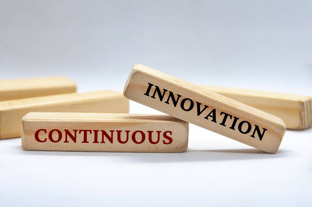 Continuous Innovation text on wooden blocks. Business culture and Operational excellence concept. - Photo, Image