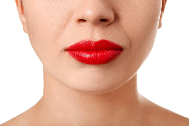 Woman with red lips on white background, closeup - Fotó, kép