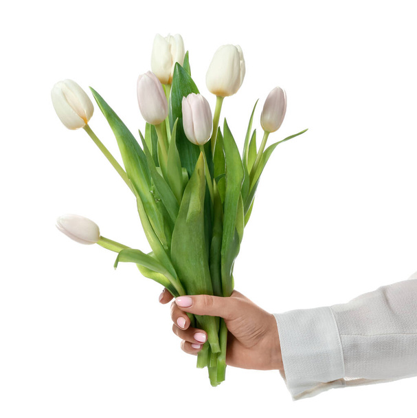 Kobieta z tulipanami na białym tle. Koncepcja pielęgnacji rąk - Zdjęcie, obraz