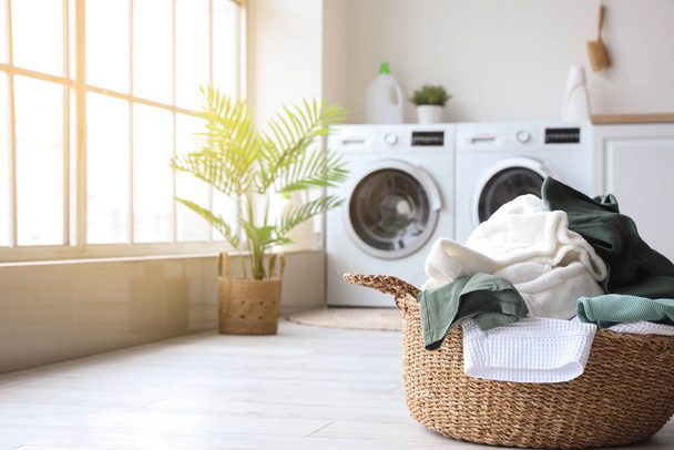 Basket with dirty clothes in laundry room - Zdjęcie, obraz