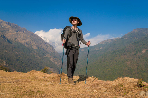 A young traveller trekking on forest trail , Nepal - Zdjęcie, obraz