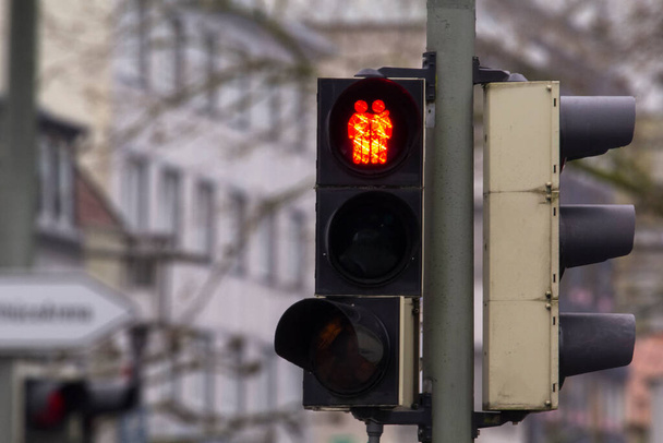 A pedestrian traffic light in support of gay female lesbian couple in Germany. Traffic light showing two women crossing holding their hands. Gay friendly concept. - Photo, Image