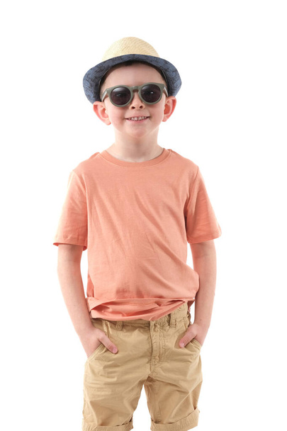 Little boy in fashionable clothes have a fun in photo studio. - Fotografie, Obrázek
