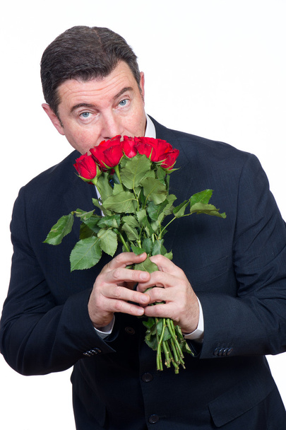 Man with roses - Фото, изображение