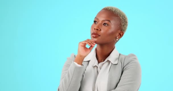 Thinking, happy and black woman in studio with idea, decision and contemplation on blue background. Deciding, choice and female employee smile with positive mindset, ambition and empowering idea. - Footage, Video